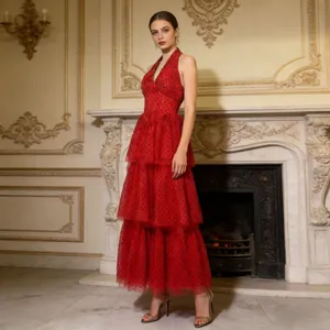 Full-length view of a vintage red halter V-neck tiered mesh dress with polka dots.