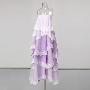 Elegant purple tiered maxi dress with delicate white lace trim and spaghetti straps