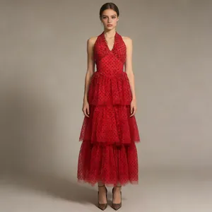 Full view of a retro red polka dot halter gown with layered mesh skirt for banquet events.