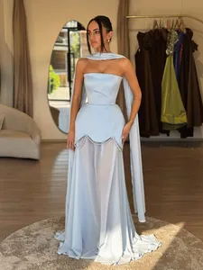 Elegant light blue strapless evening gown with sheer mesh skirt and pearl trim