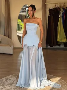 Elegant strapless light blue evening dress with mesh paneling and beaded pearl details