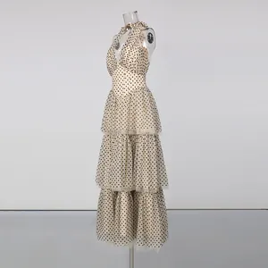 Side profile of retro polka dot evening gown showing detailed tiered mesh skirt layers