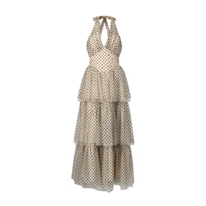 Elegant polka dot halter maxi dress with tiered mesh skirt and V-neckline for parties.