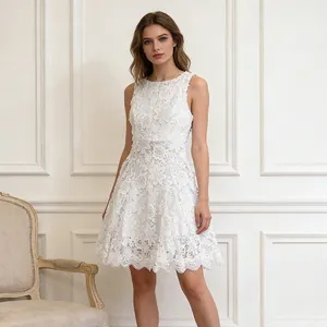 Elegant white sleeveless dress featuring intricate floral lace embroidery and a round neck