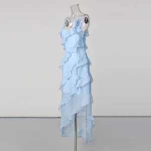 Detail view of light blue vacation ruffled dress with elegant floral embellishment