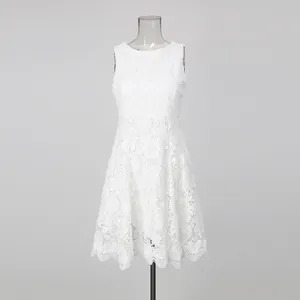 Full front view of elegant sleeveless white lace embroidery mini dress on mannequin