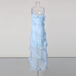 Light blue ruffled strap maxi dress with an asymmetrical sheer hem for a stylish vacation look