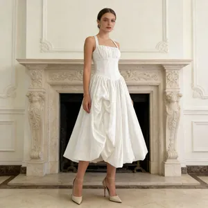 Elegant French style white sleeveless midi dress with a voluminous skirt for women.