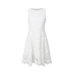 Detail view of intricate white lace embroidery on a sleeveless round-neck dress