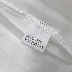 Detailed close-up showing the material care label with 65% cotton and 35% polyester blend