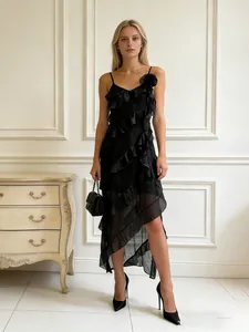 Sexy black slip dress with ruffles and asymmetric hem for resort style wear.