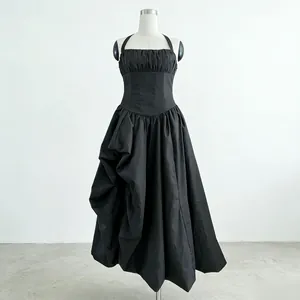 Elegant black halter dress featuring a pleated corset bodice and a voluminous ruffled skirt.