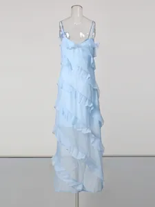 Sky blue spaghetti strap maxi dress with elegant ruffle layers for vacation style.