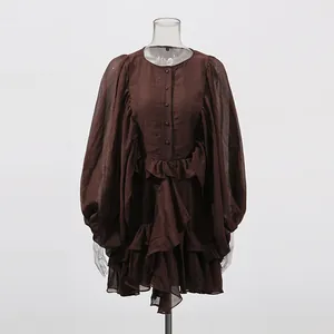 Front view of a brown palace style mini dress with puff lantern sleeves and ruffles