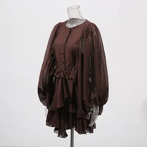 Side detail view of a dark brown court-style dress with lantern sleeves and ruffles