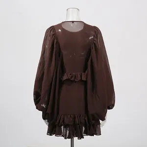 Back view of brown lantern sleeve mini dress with ruffled hem and palace style