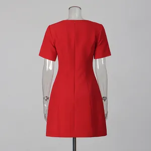 Back view of elegant red short-sleeved dress with a cinched waist and back zipper