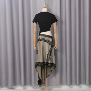 Back detail of a French romantic dress featuring black lace trim and irregular hemline.