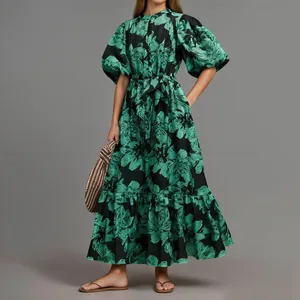 Full view of elegant green floral maxi dress with puff sleeves and belted waist.