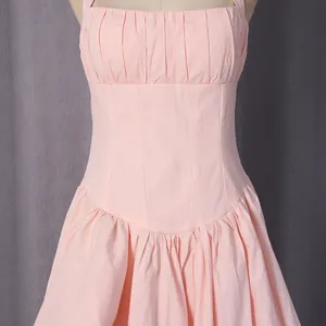 Detail view of the pleated bodice and cinched waistline of a pink French-style dress