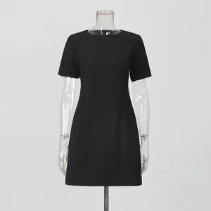Elegant black short-sleeved mini dress with a round neck and slim fit on a mannequin