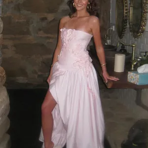 Elegant pink strapless maxi dress featuring 3D floral appliques and a high leg slit