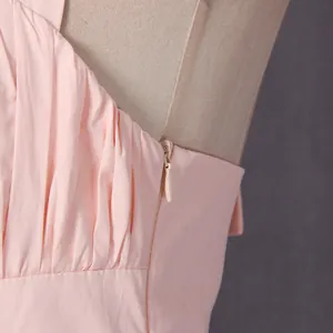 Close-up detail showing the high-quality invisible side zipper of this pink maxi dress.