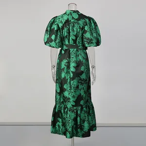 Back view of elegant green floral print maxi dress with puff sleeves and tie waist