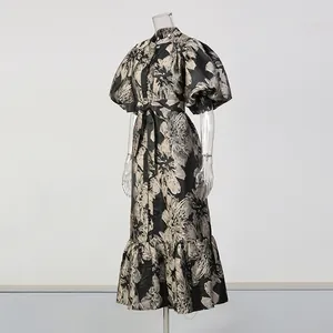 Elegant floral puff sleeve maxi dress with waist tie, detailed view of the design and fabric.