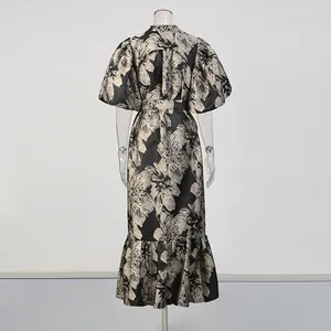 Detailed back view of a floral print long dress with elegant puff sleeves and waist tie