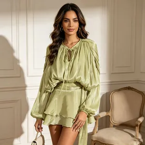 Elegant pistachio green mini dress featuring chic puff sleeves and ruffled hem details.