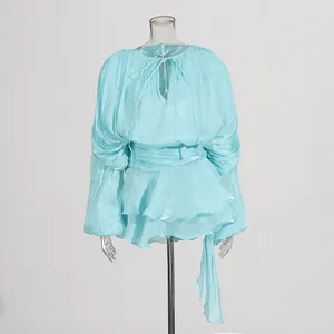 Front view of turquoise pleated puff sleeve ruffle mini dress shown on a mannequin