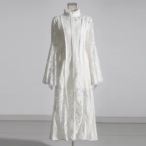 Full-length white lace dress featuring elegant bell sleeves and a high stand collar detail.