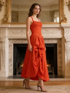 Elegant orange French-style sleeveless maxi dress with slit design and straps