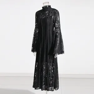 Full view of black lace maxi dress highlighting the stand collar and bell sleeve details.
