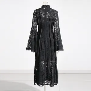 Back view of black lace long dress featuring elegant bell sleeves and a stand collar detail