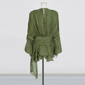 Back view of pleated olive green mini dress with puff sleeves and ruffle hem