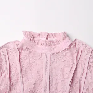 Detailed view of a ruffled stand collar on a stylish pink floral lace maxi dress.