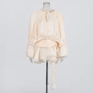 Elegant champagne pleated mini dress with bubble sleeves and ruffled hem details