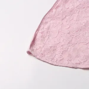 Exquisite pink floral lace fabric close-up detailing for elegant women's long dress