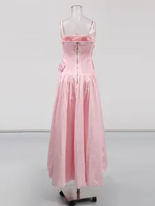 Elegant pink strapless maxi dress featuring 3D floral applique and smocked back detail.