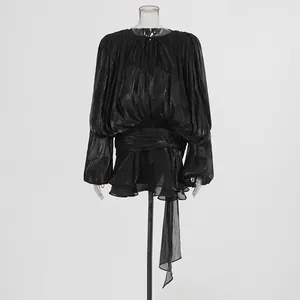 Elegant black pleated mini dress featuring puffy lantern sleeves and a ruffled hem detail