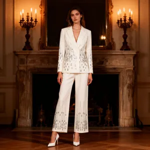 Full-length view of a white two-piece suit featuring silver sequin geometric patterns
