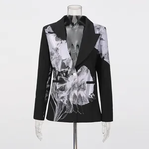 Front view of stylish black blazer featuring an oversized artistic grey floral print