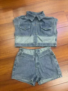 Detailed view of color-block denim set with cropped vest and high-waisted shorts