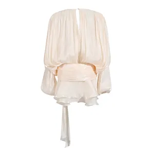 Back view of elegant cream pleated mini dress with puff sleeves and tie waist detail
