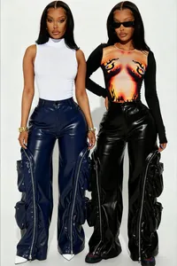 Detail of faux leather cargo pants with multi-pockets and zippers in blue and black.