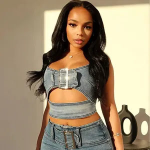 Stylish denim two-piece set featuring cut-out crop top and jeans with large buckles
