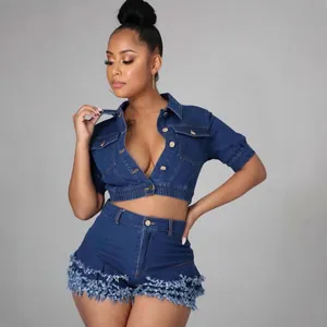 Fashionable dark blue denim two-piece set featuring cropped jacket and fringe shorts