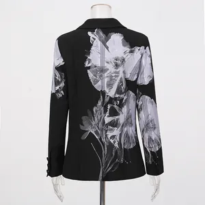 Detailed back view of a chic black blazer featuring a large white floral print design